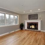 Family room in remodeled home with brick fireplace